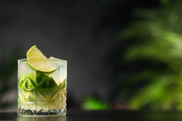 Brazilian caipirinha drink with cachaça, lemon, sugar and ice