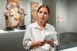 © JackF - Positive woman in hall of the historical museum