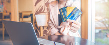 Women Hold Three Credit Cards To Shop Online.