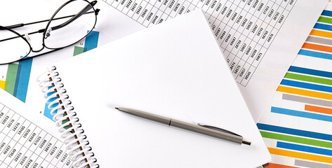 Poster - Notebook on graphs and charts. Top view with copy space. Business concept