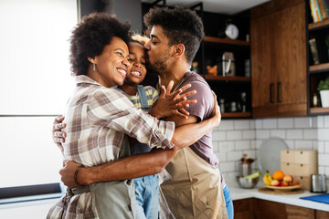 Happy family having fun together at home in the kitchen