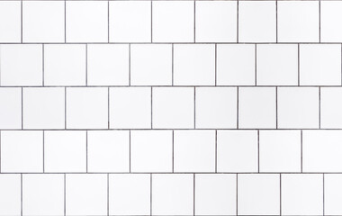 Wall Mural - White tile background. Wall with white tiles for the interior of the kitchen or bathroom in the house. Decor, design and decoration of kitchen and bathroom interiors