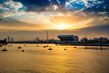 Beautiful Dubai city skyline panoramic view from Festival City in Dubai, United Arab Emirates. Dubai skyline in the evening or sunset with a colorful cloudy sky.