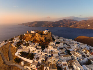 Wall Mural - Aerial view at sunset from the drone of the Chora village of the Greek island of Astipalaia