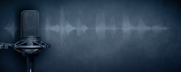 podcast background with studio microphone and waveform on dark blue concrete background. podcasting 