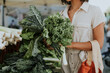 © Rawpixel.com - Beautiful woman buying kale at a farmers market