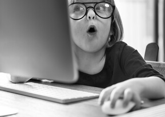 cute girl playing on a computer