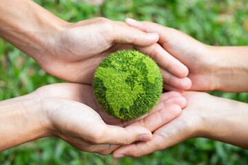 environment earth day two hands holding together a green earth. environmental and reduce global warm