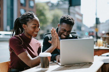 Students giving each other a high five