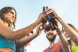 © Lomb - Reunion of young people toasting with beer bottle with lowered face mask