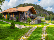 Luxury Homes Exterior. Houses In Suburb At Summer In North Nature. Luxury House With Nice Landscape. Suburban Luxury Homes Exterior In Wood. Scandinavian Style Cottage At Foot Of A Cliff.