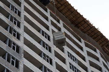 crane lifts a package with building blocks