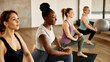 © Drazen - Group of young athletic women doing relaxation exercises at health club.