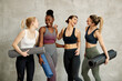 © Drazen - Cheerful multi-ethnic group of athletic women having fun together.