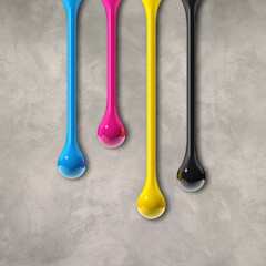 Wall Mural - cmyk ink drops on grey concrete square background