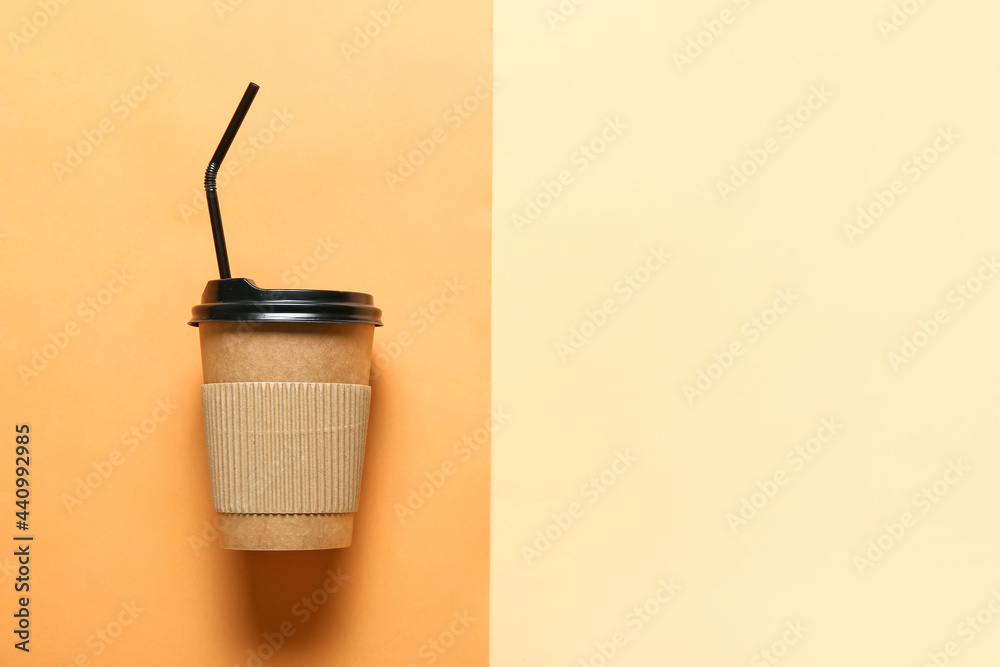 Takeaway cup for drink with straw on color background