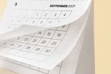 Flip Calendar With Page Of September On Color Background, Closeup