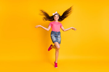 Sticker - Photo of shiny pretty small schoolgirl dressed pink t-shirt jumping high dancing smiling isolated yellow color background