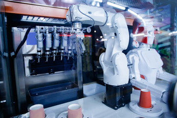 Wall Mural - Robot working in industrial food factory packaging ice cream. Concept automated production line