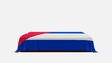 Side View Of A Casket On A White Background Covered With The Country Flag Of Cuba