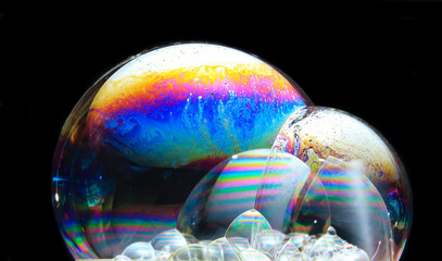 Poster - Colorful soap bubbles on a black background