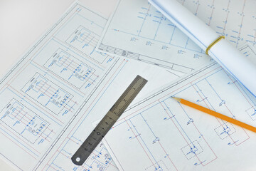 Printed electrical diagrams, top view. Construction, electrical or engineering concept. Wiring diagram, ruler and pencil