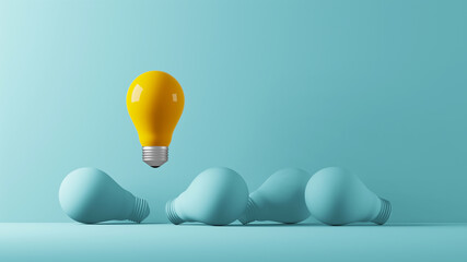 light bulb yellow floating outstanding among lightbulb light blue on background. concept of creative