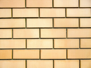 Sand-colored  brick wall