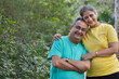© IndiaPix - A HAPPY HUSBAND AND WIFE LEANING ON EACH OTHER AND POSING