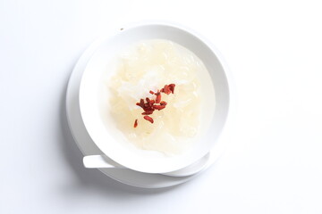 chilled double boiled fresh bird nest with hashima and wolf berries asian sweet soup in white bowl healthy dessert menu