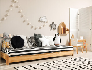 Poster - Cute kids room with stylish comfortable floor bed and toys. Montessori interior