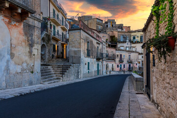 Wall Mural - Narrow typical italian old street in Ragusa (Ragusa Ibla), Sicily, Italy , UNESCO heritage town on Italian island of Sicily. View of the city Ragusa Ibla, Val di Noto, Sicily, Italy.