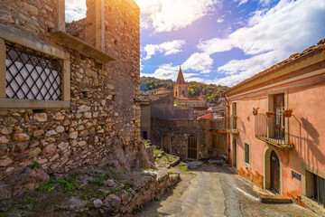 Picturesque street with the Duomo in the background in Novara di Sicilia, Sicily, Italy. Amazing cityscape of Novara di Sicilia town. Mountain village Novara di Sicilia, Sicily, Italy.