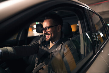 Attractive man driving car