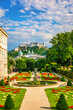 © daliu - Beautiful view of famous Mirabell Gardens with the old historic Fortress Hohensalzburg in the background in Salzburg, Austria. Famous Mirabell Gardens with historic Fortress in Salzburg, Austria.