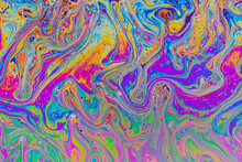 Fluid Soap Bubble Psychedelic Colorful Abstract Art. Surreal Patterns With Rainbows And Waves Of Color In Motion.