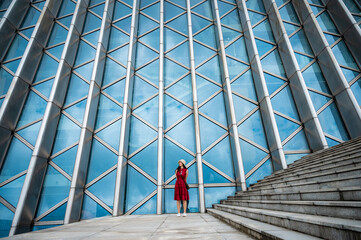 Asian woman in red dress at modern building, female girl with urban city lifestyle