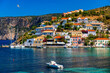© daliu - Assos village in Kefalonia, Greece. Turquoise colored bay in Mediterranean sea with beautiful colorful houses in Assos village in Kefalonia, Greece, Ionian island, Cephalonia, Assos village.