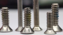 Close-up Of Screws On Table
