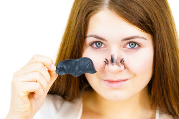 Wall Mural - Woman removing pore strips mask from nose