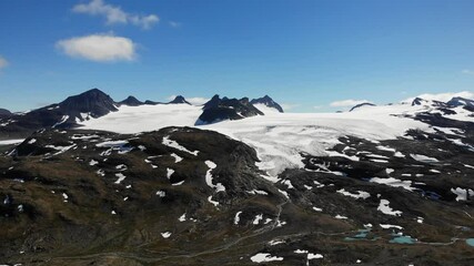 Poster - Mountain landscape  in summertime with snowy peaks and glaciers. National tourist scenic route 55 Sognefjellet between Lom and Luster, Norway.