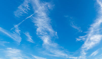 Wall Mural - abstract white clouds and blue sky in sunny day background.natural celestial world concept with blue
