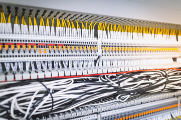 Wiring PLC Control panel with wires industrial factory.Wiring terminals in the electrical Cabinet. Electrical wires or cables are connected to electrical equipment