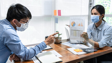 Wall Mural - Two business colleagues showing and pointing on financial document for discussion in new business