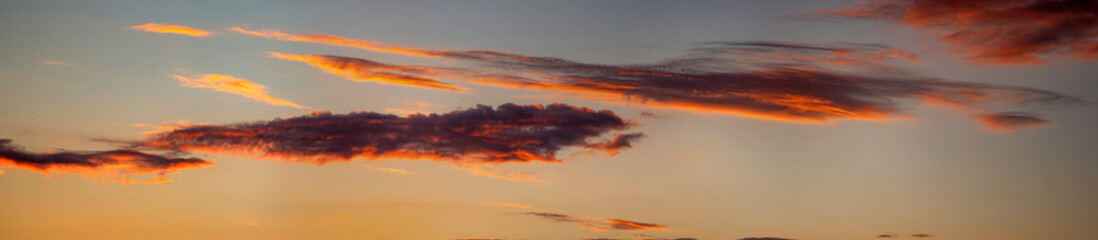 Wall Mural - beautiful colorful orange clouds at sunset