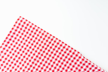 Top view for food menu design. Used to cover the dining table, for easy to clean the table. A crumpled dining tablecloth with a white and red checker isolated pattern is placed on a white background.