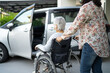 Help and support asian senior or elderly old lady woman patient sitting on wheelchair prepare get to her car, healthy strong medical concept.
