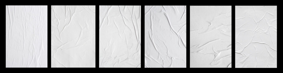 Wall Mural - white crumpled and creased glued paper poster set isolated on black background