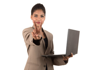 young woman holding a laptop while showing victory sign. isolated on white background