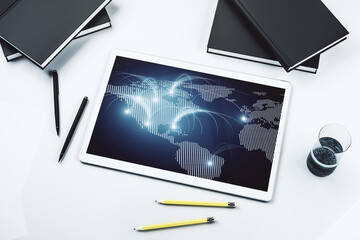 Poster - Top view of modern digital tablet monitor with abstract world map with connections, research and strategy concept. 3D Rendering